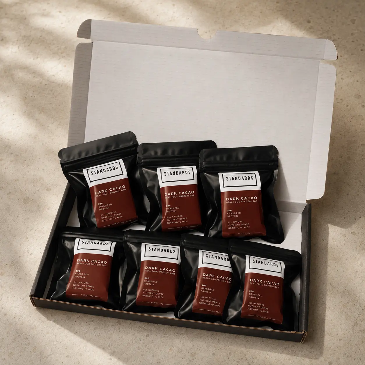 The seven bar box opened to show the wrapped bars inside